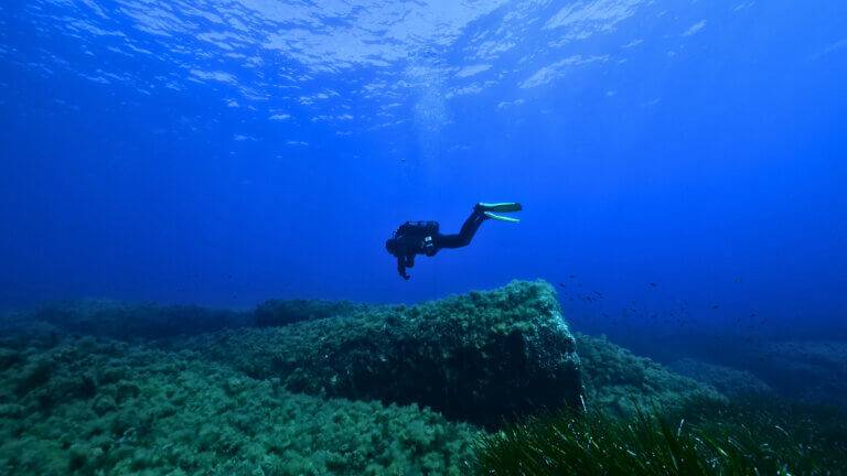 An image showing a diver at an underwater cultural heritage site.