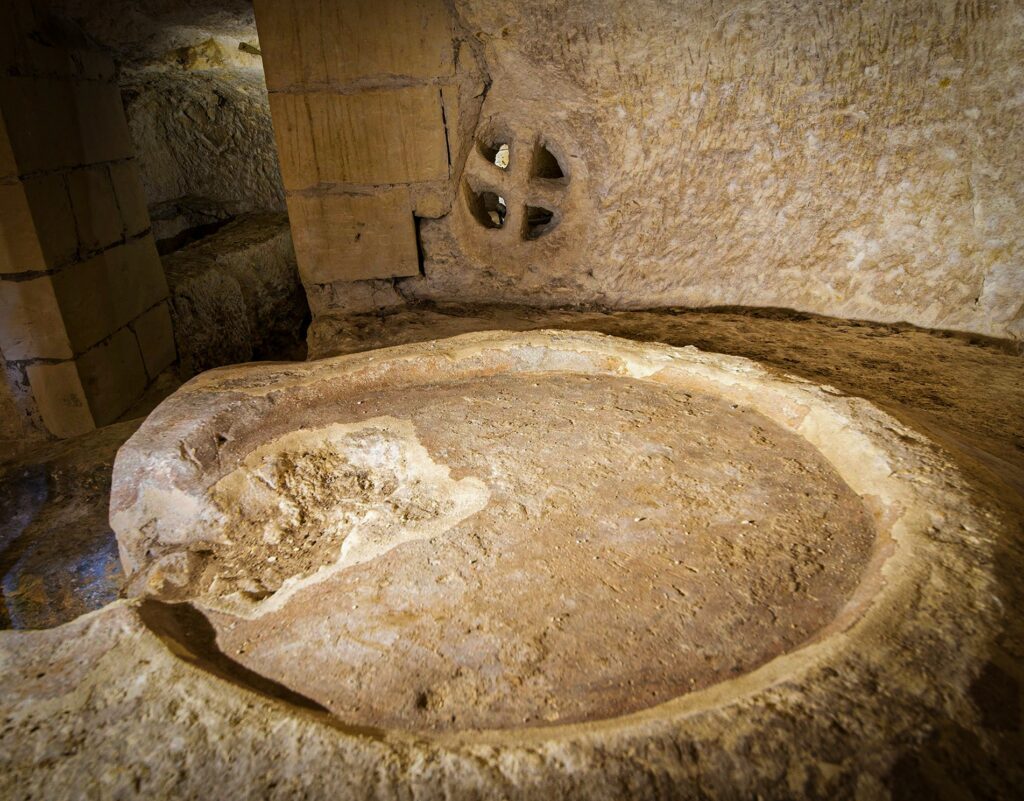 A carved stone ‘agape’ table, one of the two, within St Paul’s Catacombs.